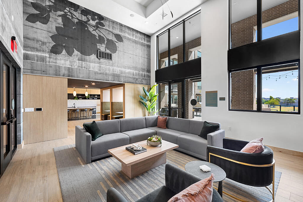 A bright, modern kitchen with dark counters and a kitchen island at the East Bend Apartments in Houston, Texas.